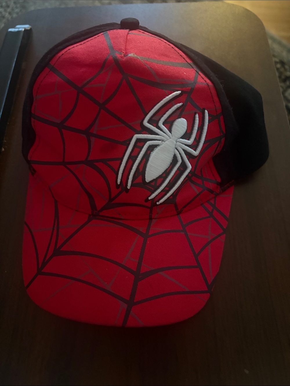 Spiderman Red and Black Spider Web Cap with White Spider Emblem